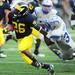 Michigan running back Dennis Norfleet looks to run the ball past Air Force's Wes Cobb during the second half at Michigan Stadium on Saturday. Melanie Maxwell I AnnArbor.com